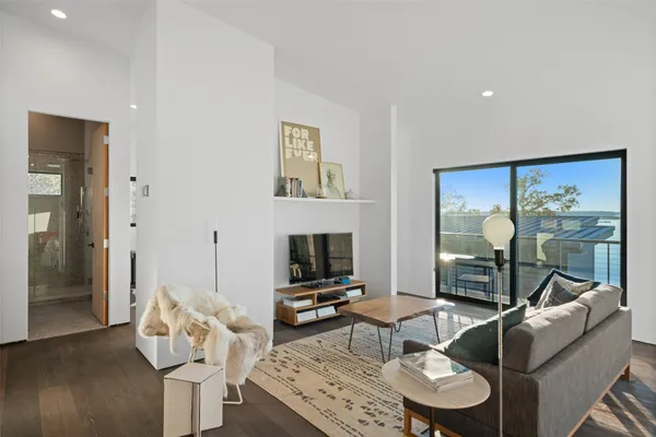 a living room with fireplace furniture and a flat screen tv