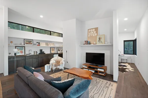 a living room with furniture and a fireplace