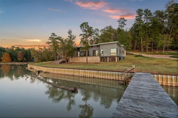 a outdoor space with lots of furniture and glass windows