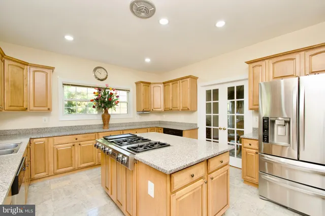 a dining room with furniture and chandelier