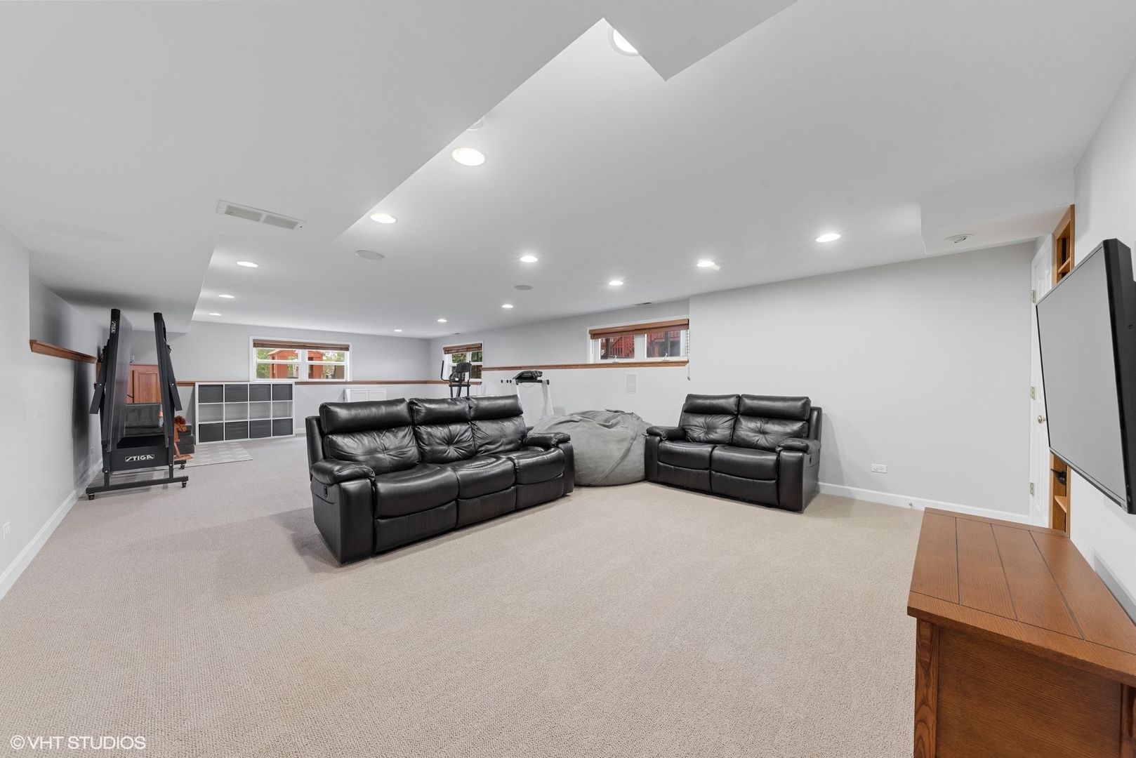 23747 North Quentin Road Lake Zurich, IL 60047 - Photo 13 of 19 a living room with furniture and a flat screen tv