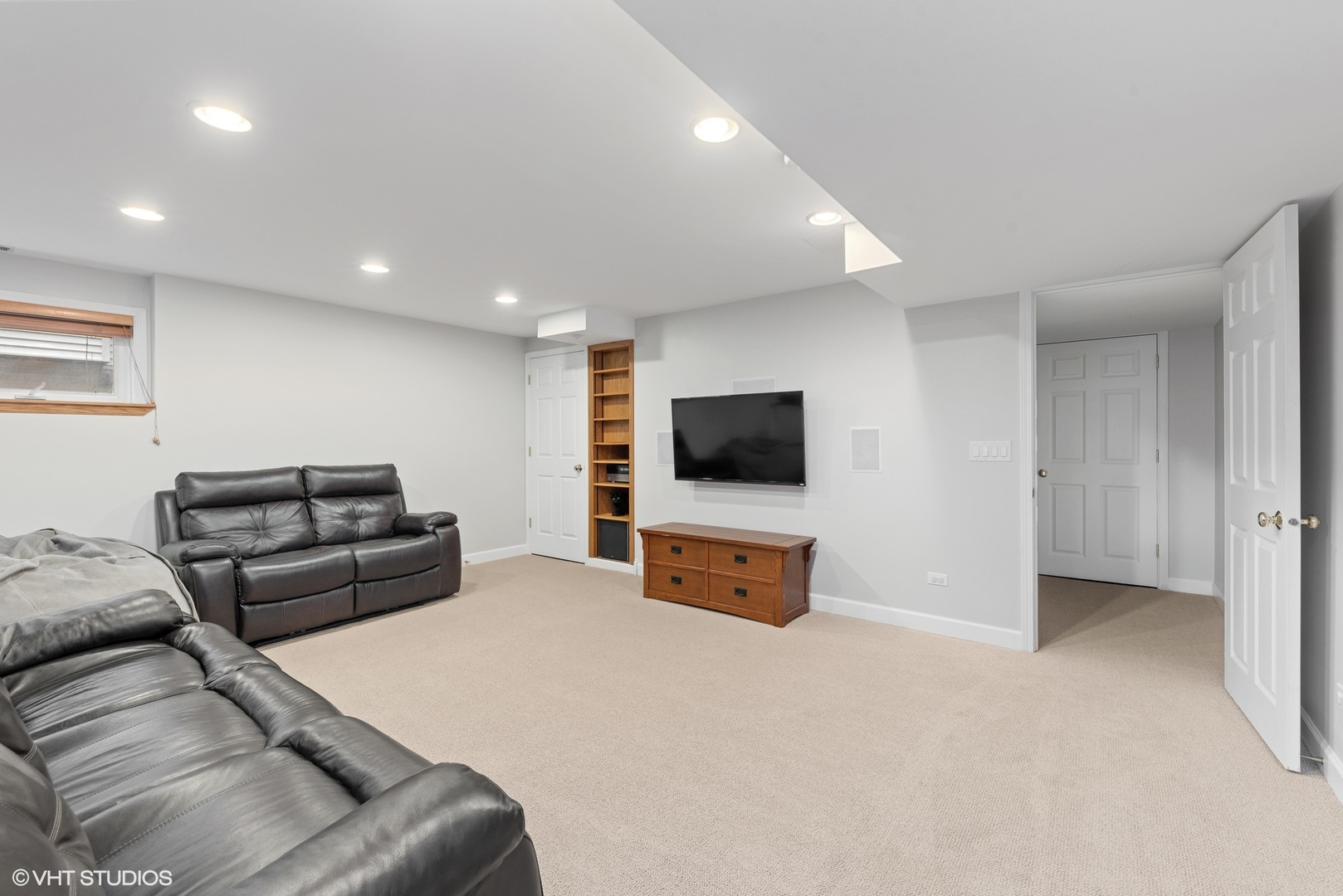 23747 North Quentin Road Lake Zurich, IL 60047 - Photo 14 of 19 a living room with furniture and a flat screen tv