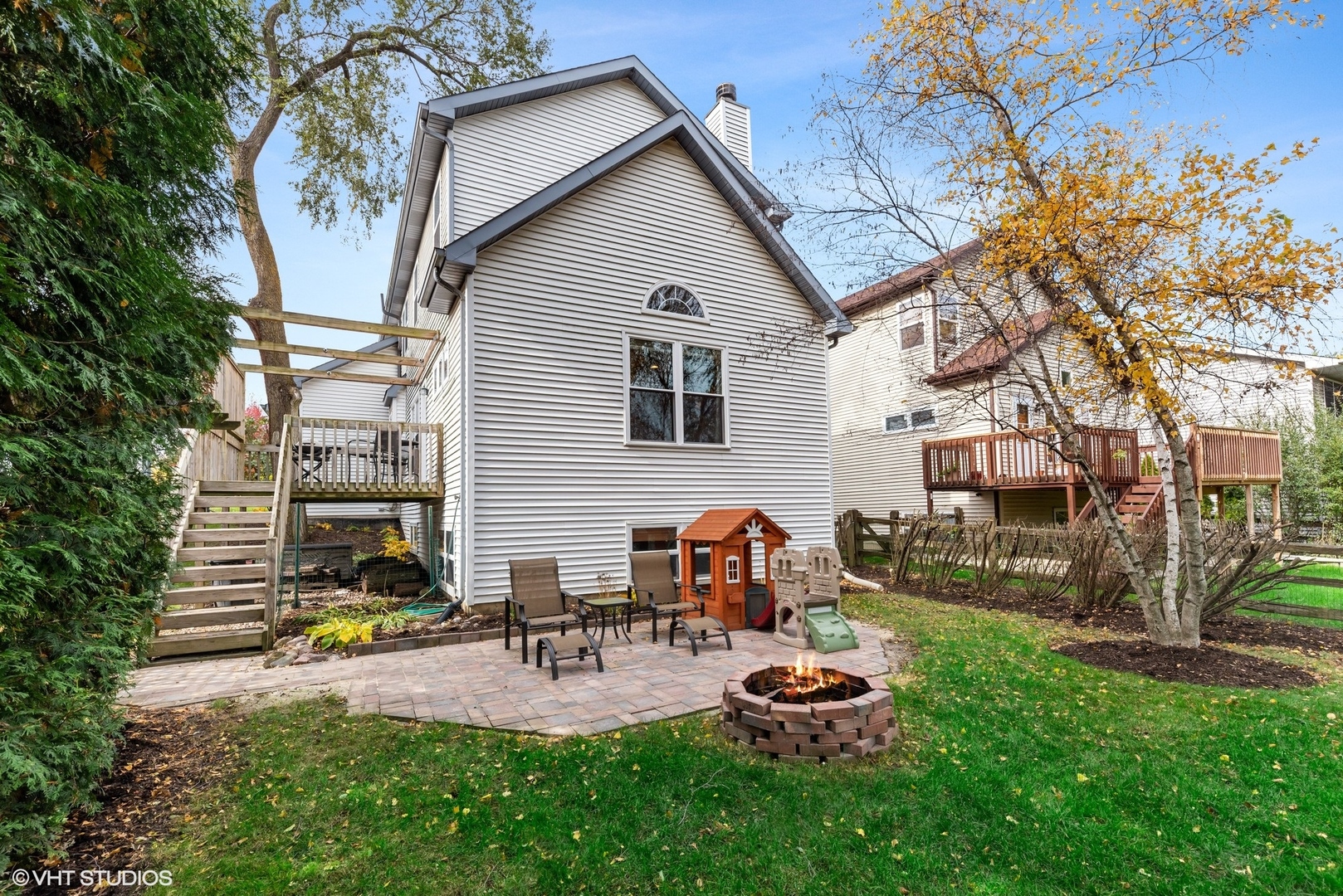 23747 North Quentin Road Lake Zurich, IL 60047 - Photo 18 of 19 a backyard of a house with fire pit and chairs