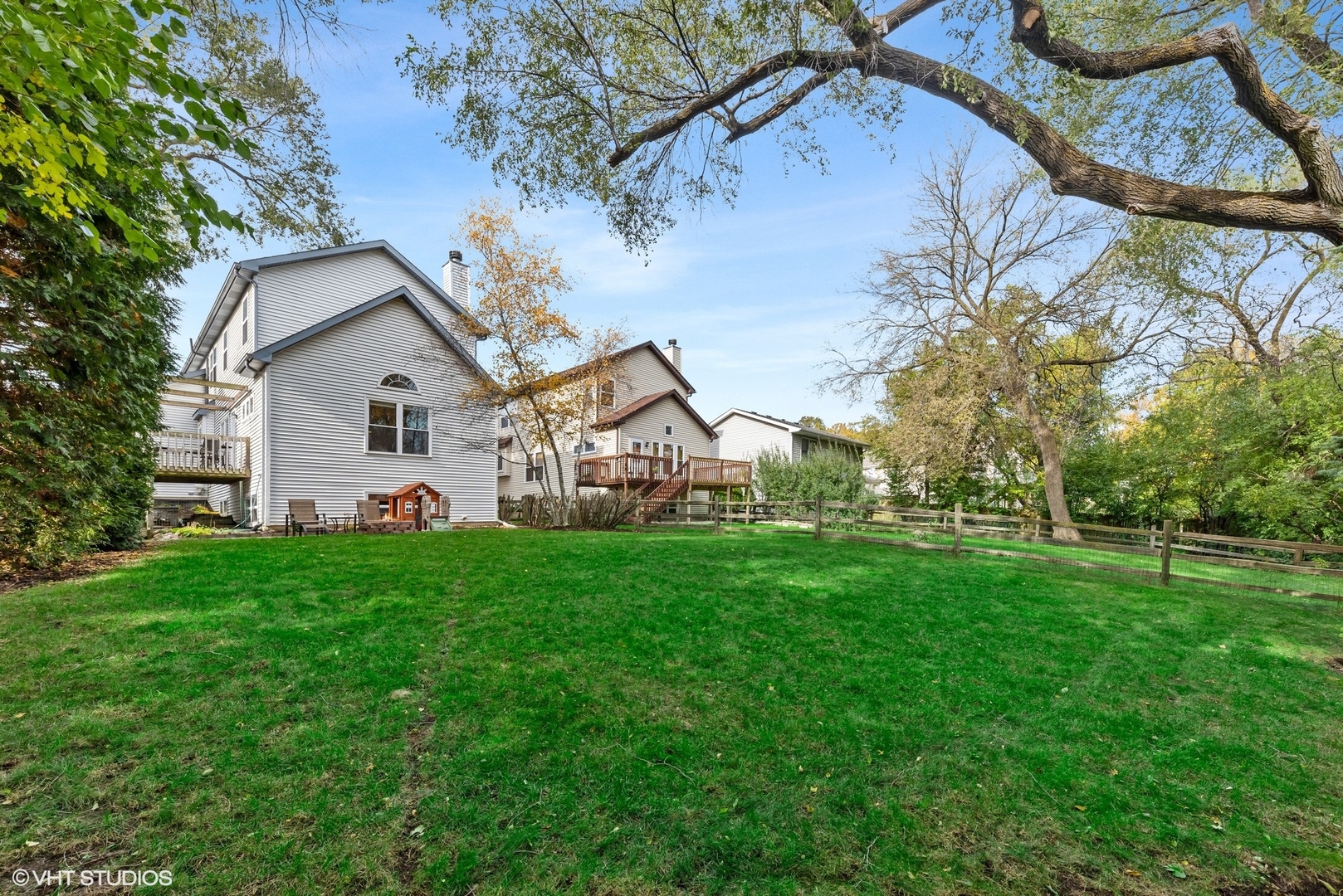 23747 North Quentin Road Lake Zurich, IL 60047 - Photo 19 of 19 a view of a big house with a big yard and large tree
