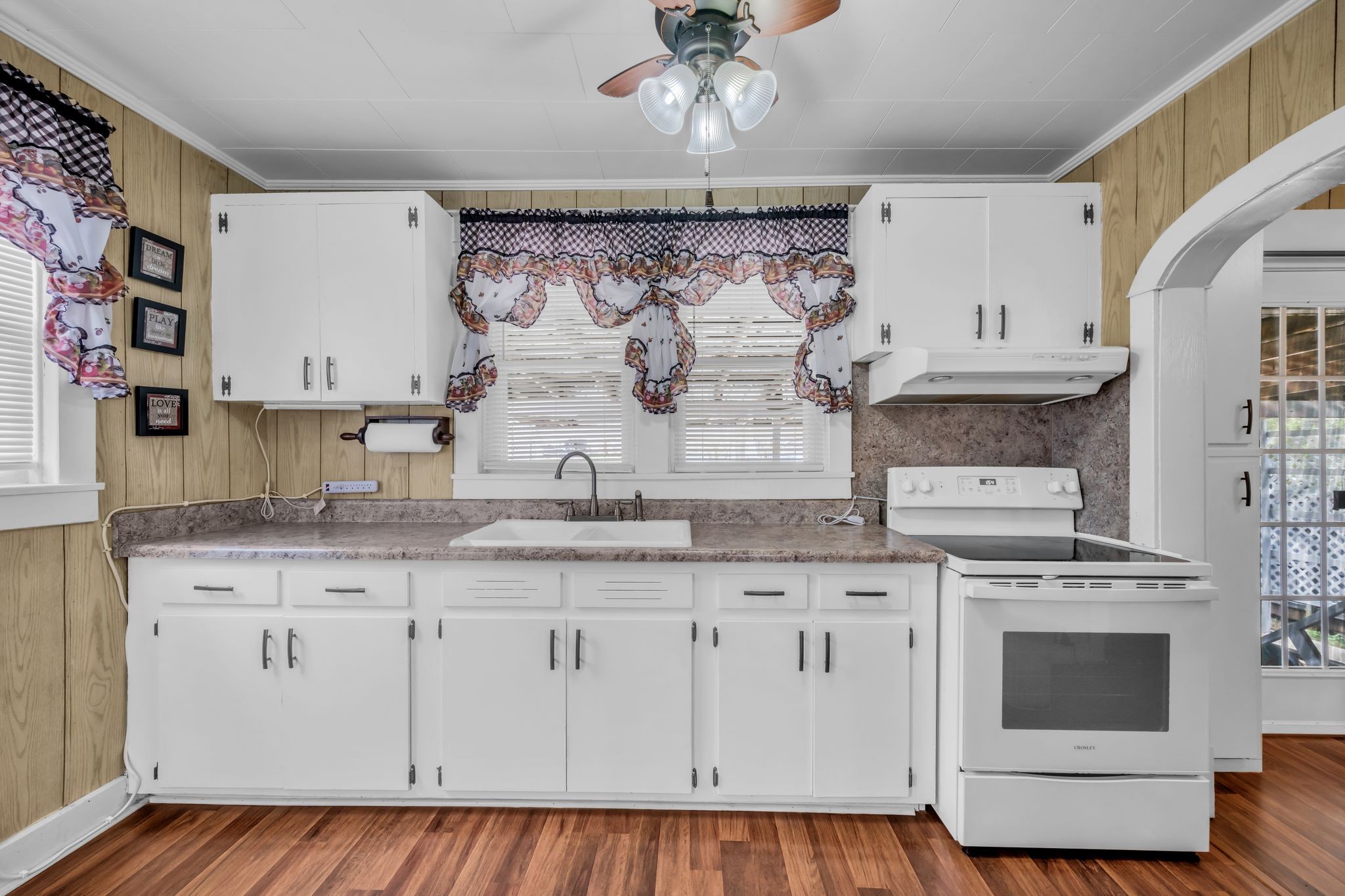 104 West Chestnut Street Dickson, TN 37055 - Photo 11 of 27 a kitchen with granite countertop white cabinets and white appliances