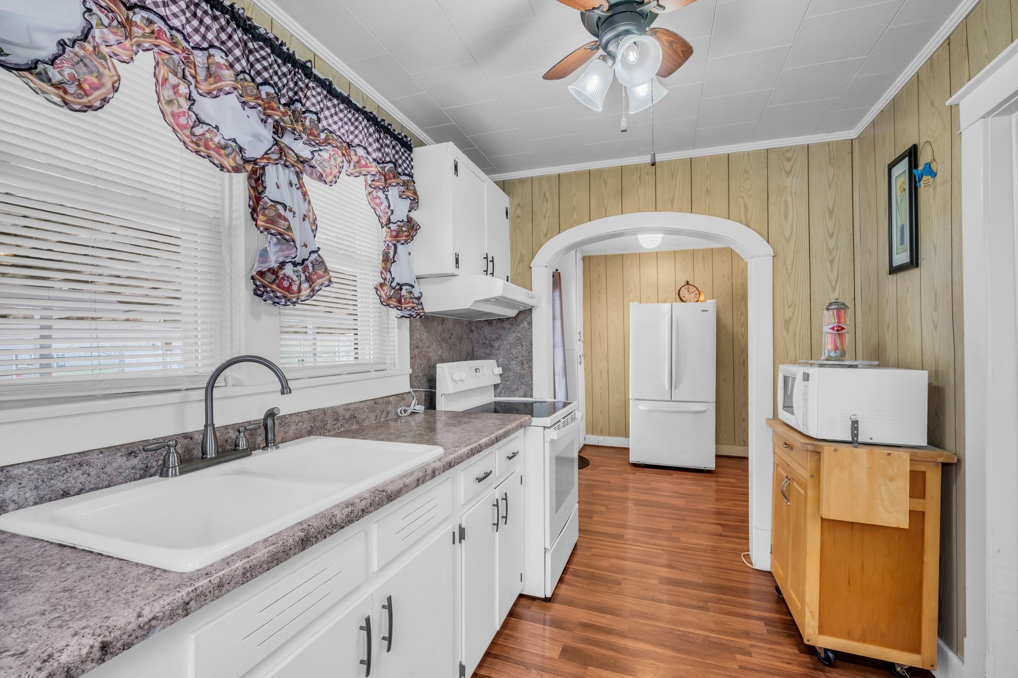 104 West Chestnut Street Dickson, TN 37055 - Photo 13 of 27 a kitchen with a sink and a refrigerator