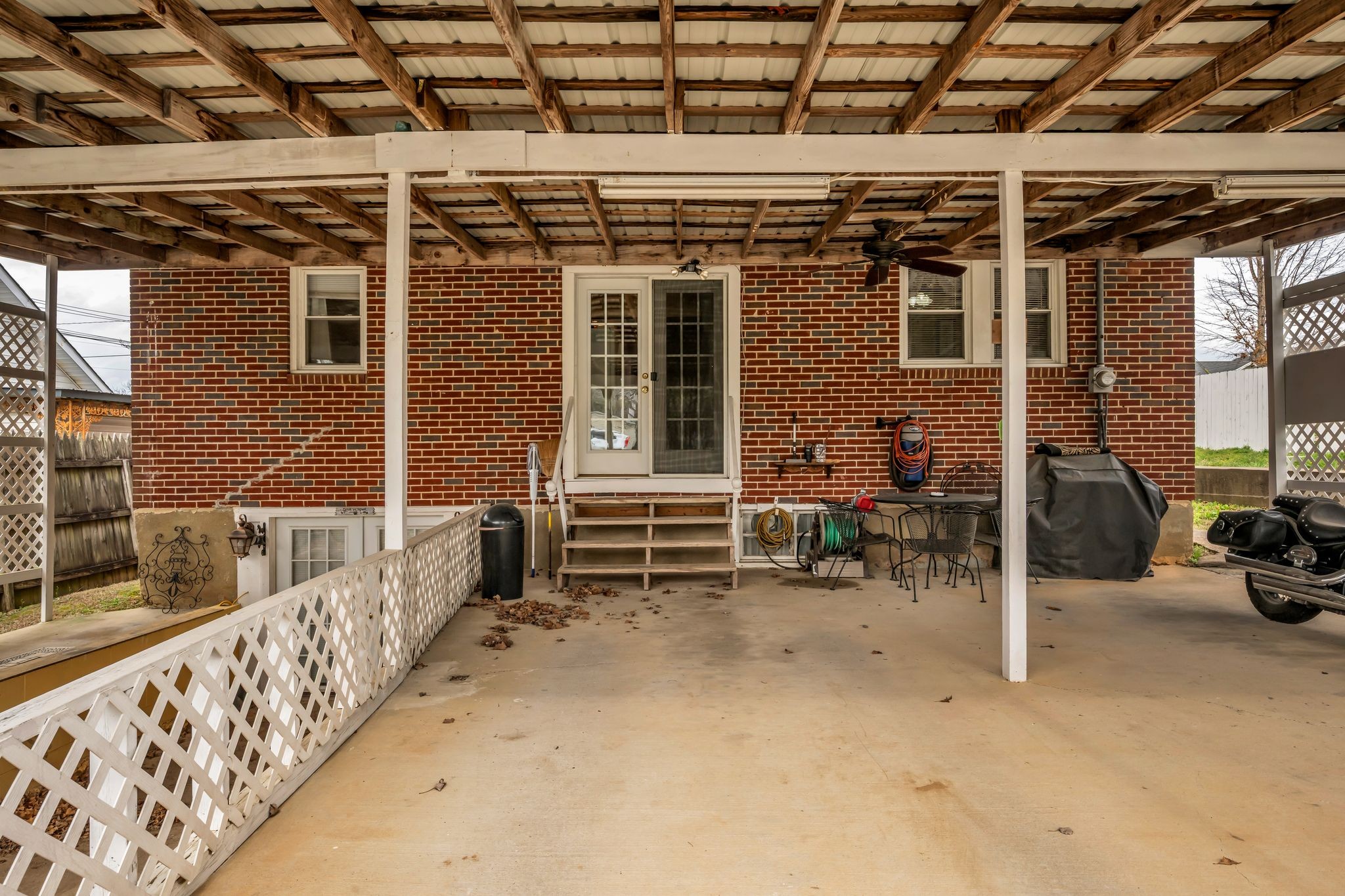 104 West Chestnut Street Dickson, TN 37055 - Photo 25 of 27 a view of a porch with chairs and a yard