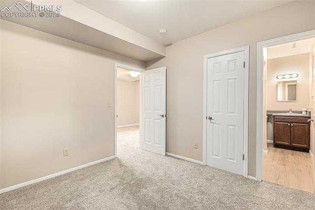 4514 Ridgeglen Road Colorado Springs, CO 80918 - Photo 15 of 29 Unfurnished bedroom featuring brand new light color carpet and ensuite bath