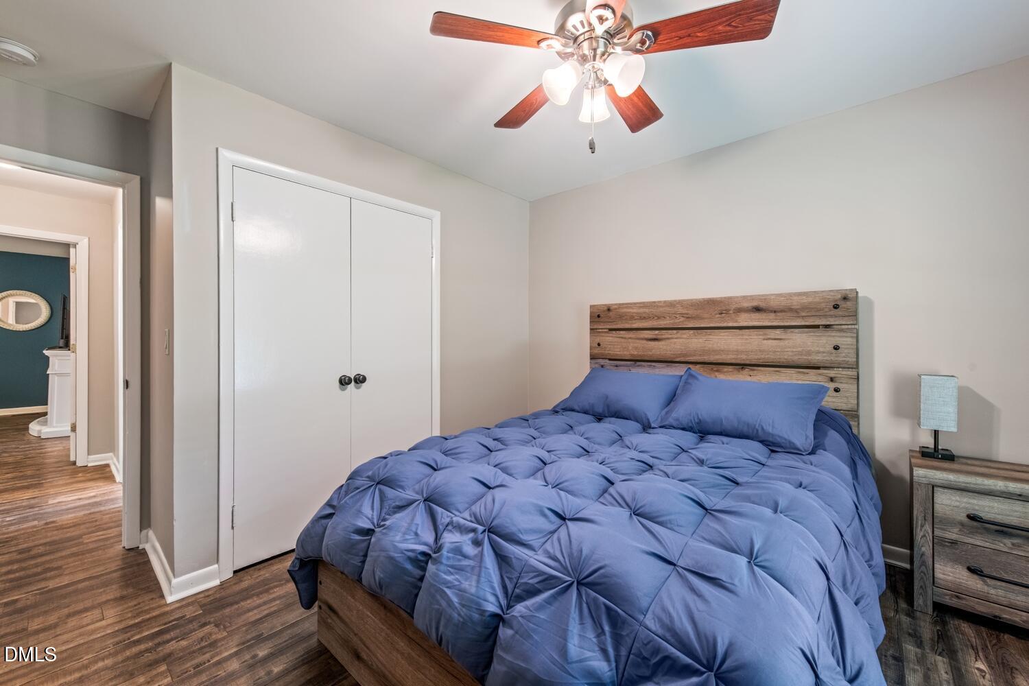 134 Longview Road Madison, NC 27025 - Photo 35 of 49 a bedroom with a bed and a chandelier
