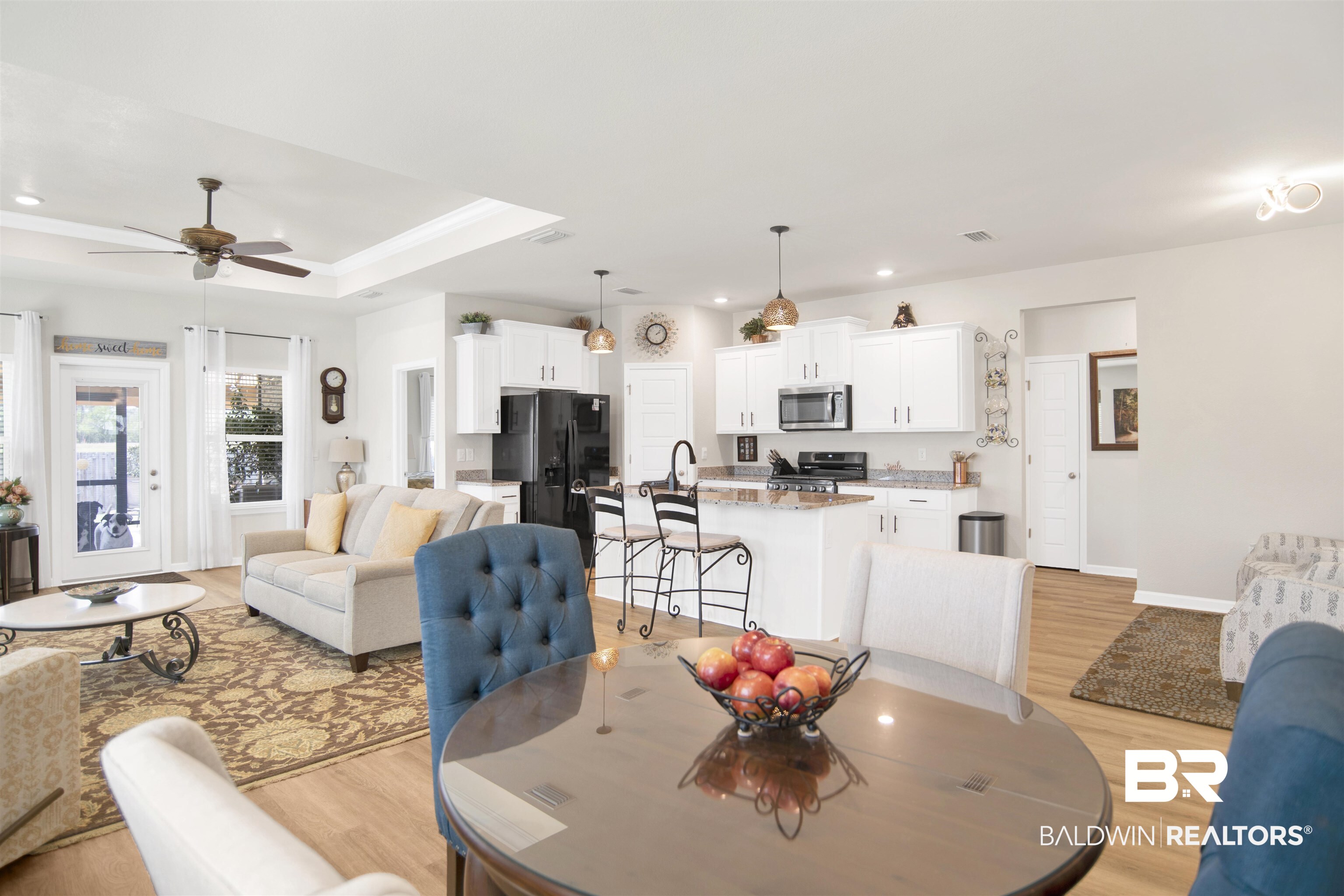 13778 Antler Hl Road Daphne, AL 36527 - Photo 11 of 38 Dining room with light wood-type flooring, a ceiling fan, a tray ceiling, and recessed lighting