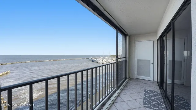 a view of a balcony with wooden floor