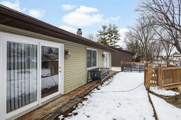 a view of house with backyard