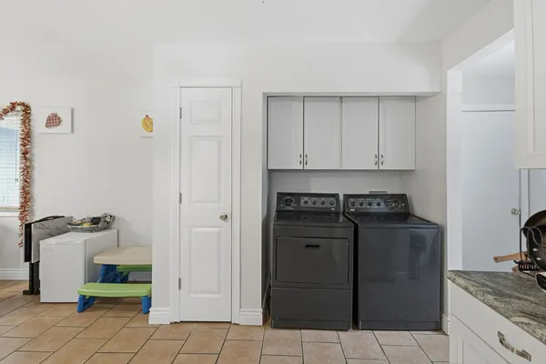 a kitchen with a stove and a refrigerator