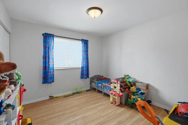 a room with toys and wooden floor