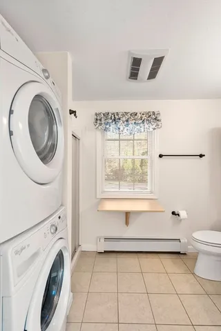 a bathroom with a toilet a sink and a mirror