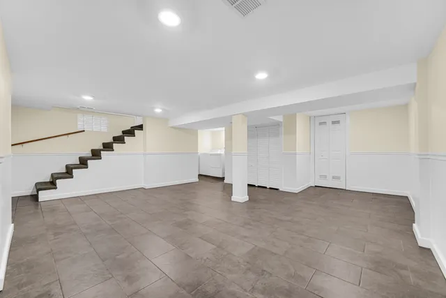 a view of an empty room with stairs