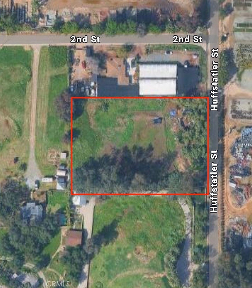 a view of a street with a building in the background