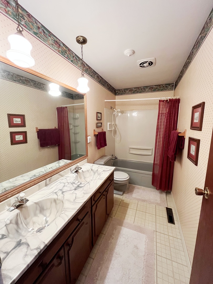 44 Marnel Road Montgomery, IL 60538 - Photo 17 of 20 a bathroom with a sink and mirror