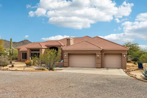 a view of a house with a outdoor space and parking space