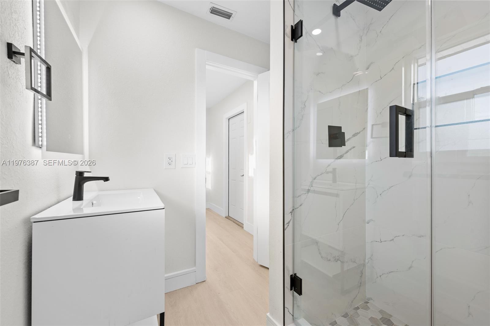 105 12th Street Southwest Ruskin, FL 33570 - Photo 29 of 89 a bathroom with a sink and mirror