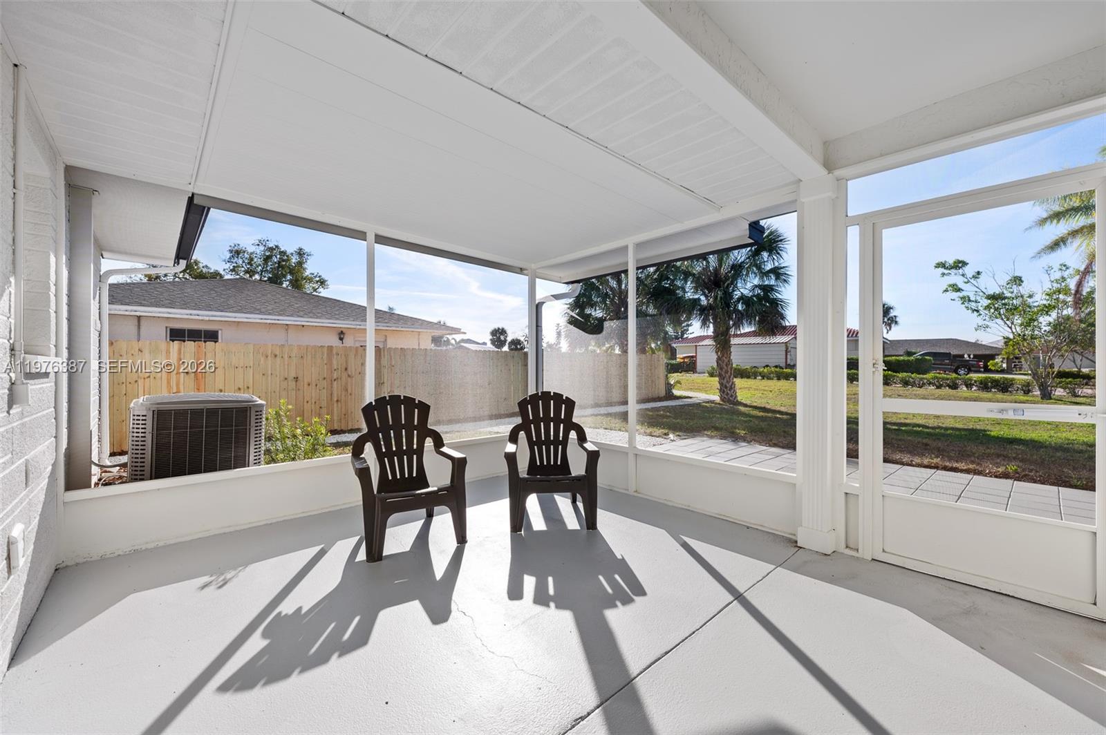 105 12th Street Southwest Ruskin, FL 33570 - Photo 41 of 89 a dining room with furniture and a large window