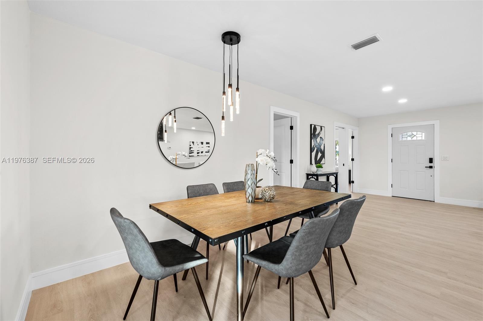 105 12th Street Southwest Ruskin, FL 33570 - Photo 42 of 89 a view of a dining room with furniture and a table