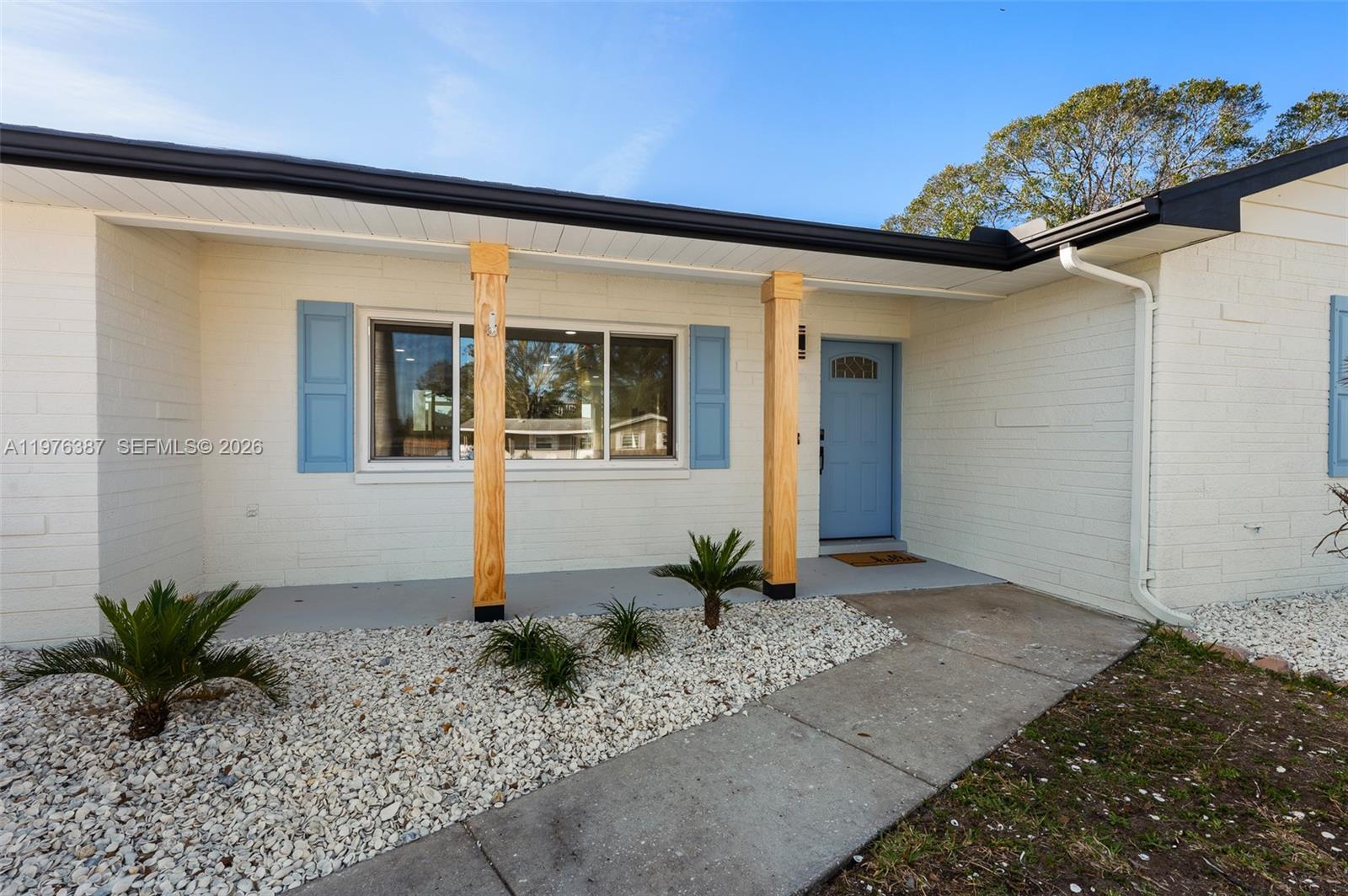 105 12th Street Southwest Ruskin, FL 33570 - Photo 55 of 89 a front view of a house with a yard