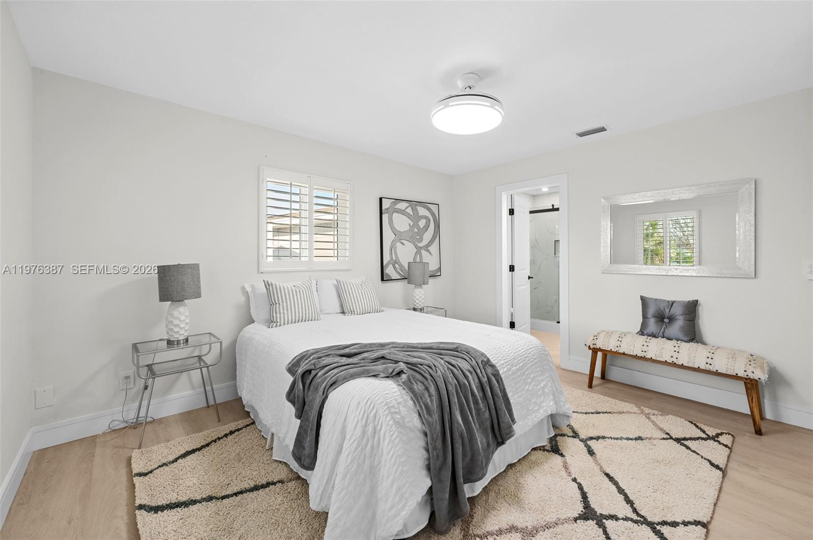 105 12th Street Southwest Ruskin, FL 33570 - Photo 6 of 89 a spacious bedroom with a bed and a couch