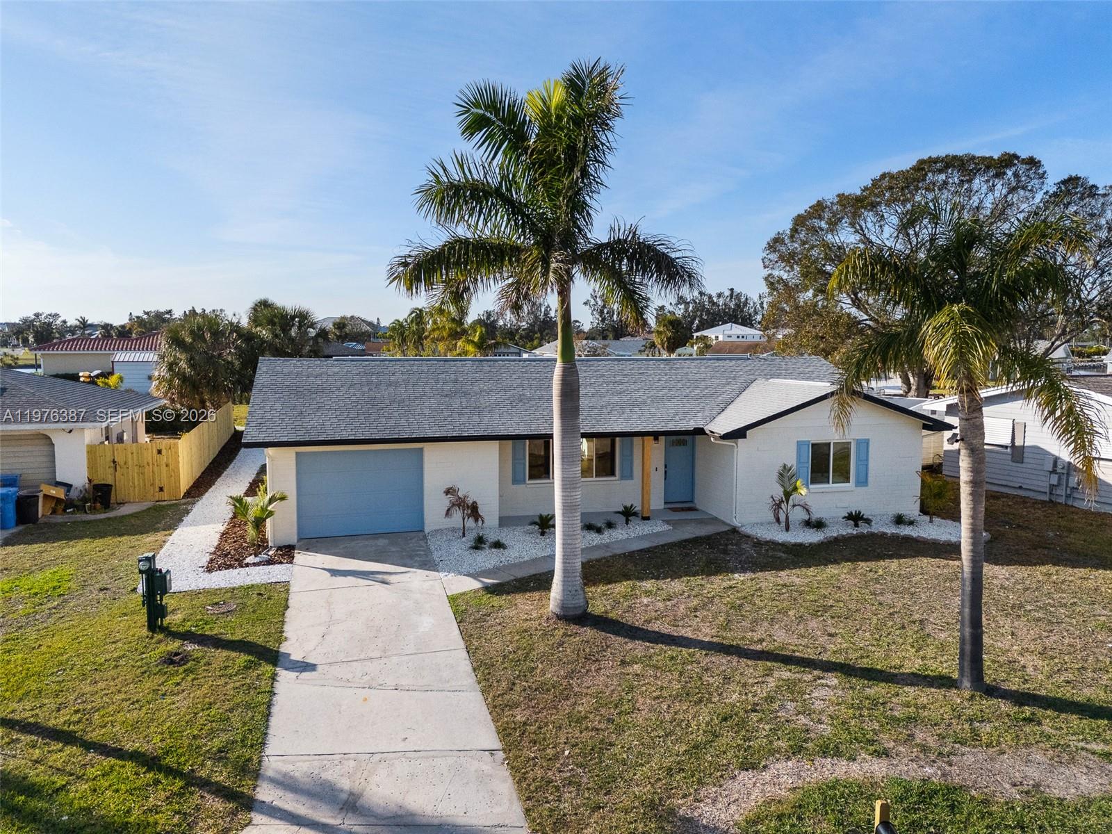 105 12th Street Southwest Ruskin, FL 33570 - Photo 61 of 89 a front view of a house with a yard