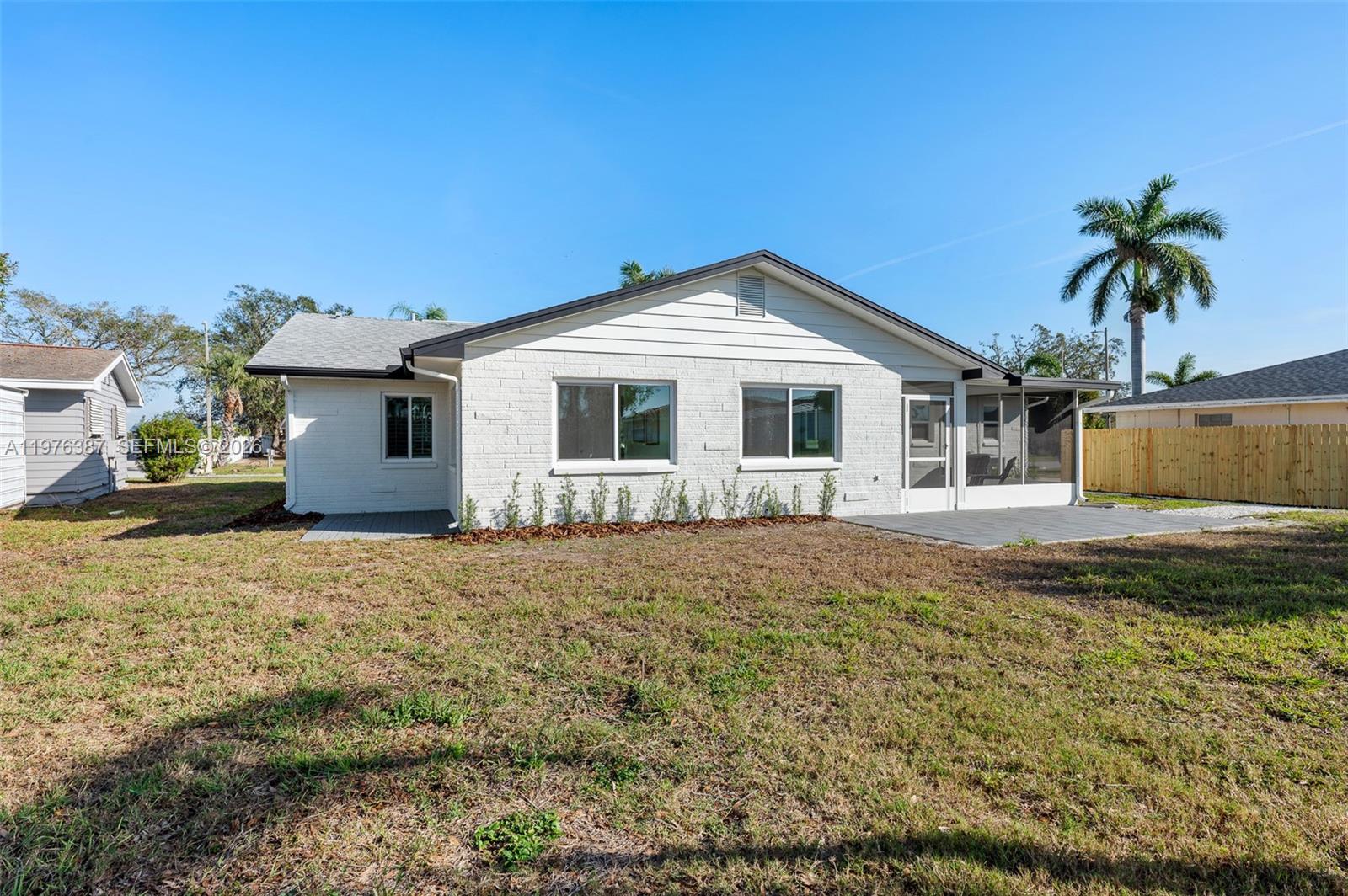 105 12th Street Southwest Ruskin, FL 33570 - Photo 66 of 89 a front view of a house with a garden