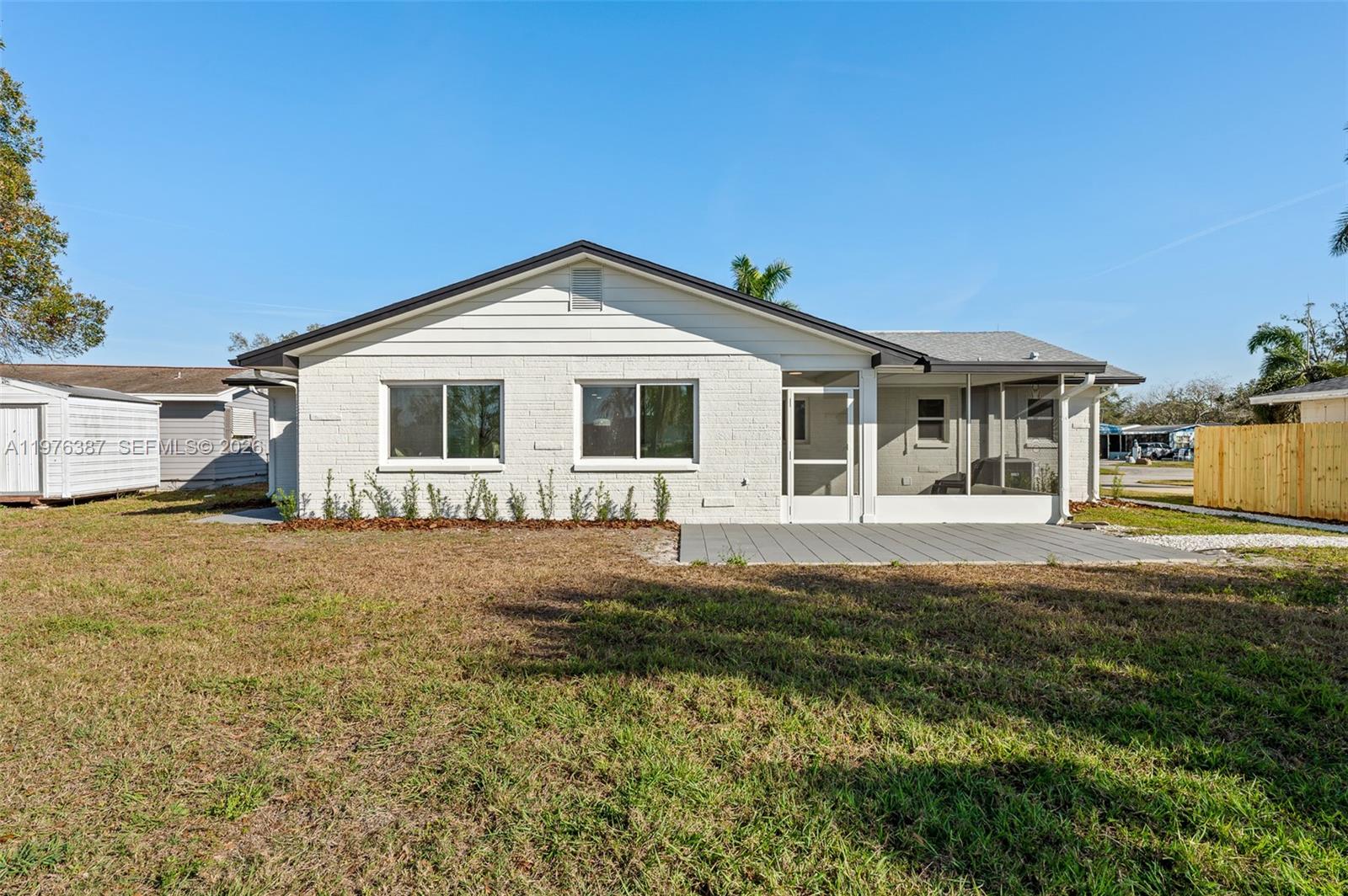 105 12th Street Southwest Ruskin, FL 33570 - Photo 67 of 89 a front view of a house with a garden