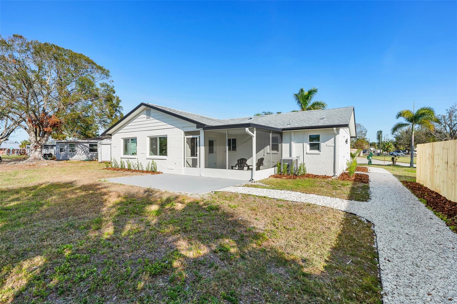 105 12th Street Southwest Ruskin, FL 33570 - Photo 69 of 89 a front view of a house with a yard