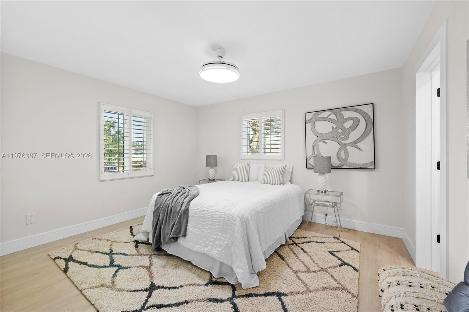 105 12th Street Southwest Ruskin, FL 33570 - Photo 7 of 89 a bedroom with a bed and a window