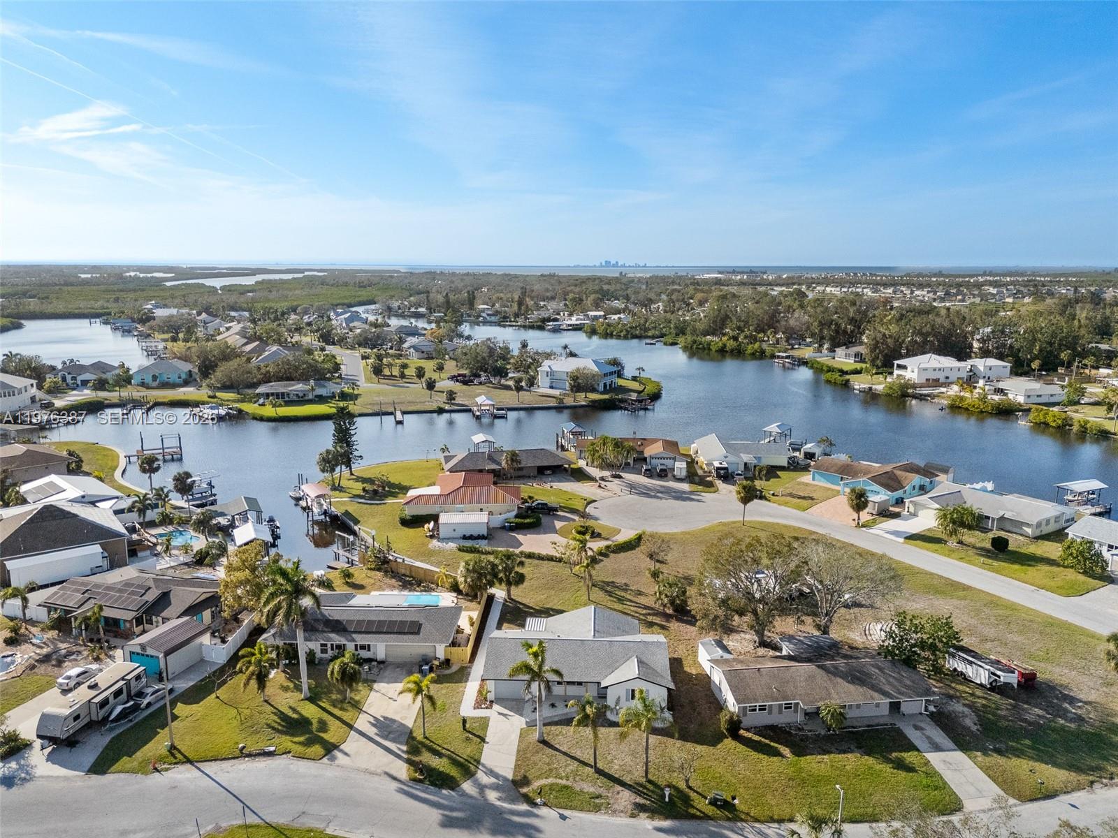 105 12th Street Southwest Ruskin, FL 33570 - Photo 76 of 89 an aerial view of ocean and residential houses with outdoor space