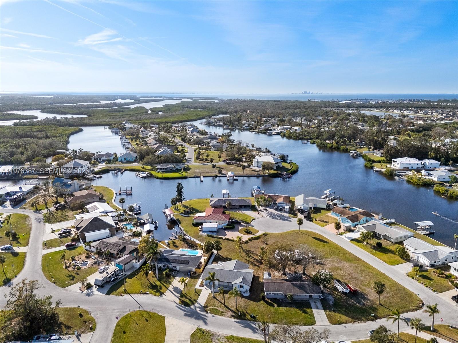 105 12th Street Southwest Ruskin, FL 33570 - Photo 80 of 89 an aerial view of ocean and residential houses with outdoor space