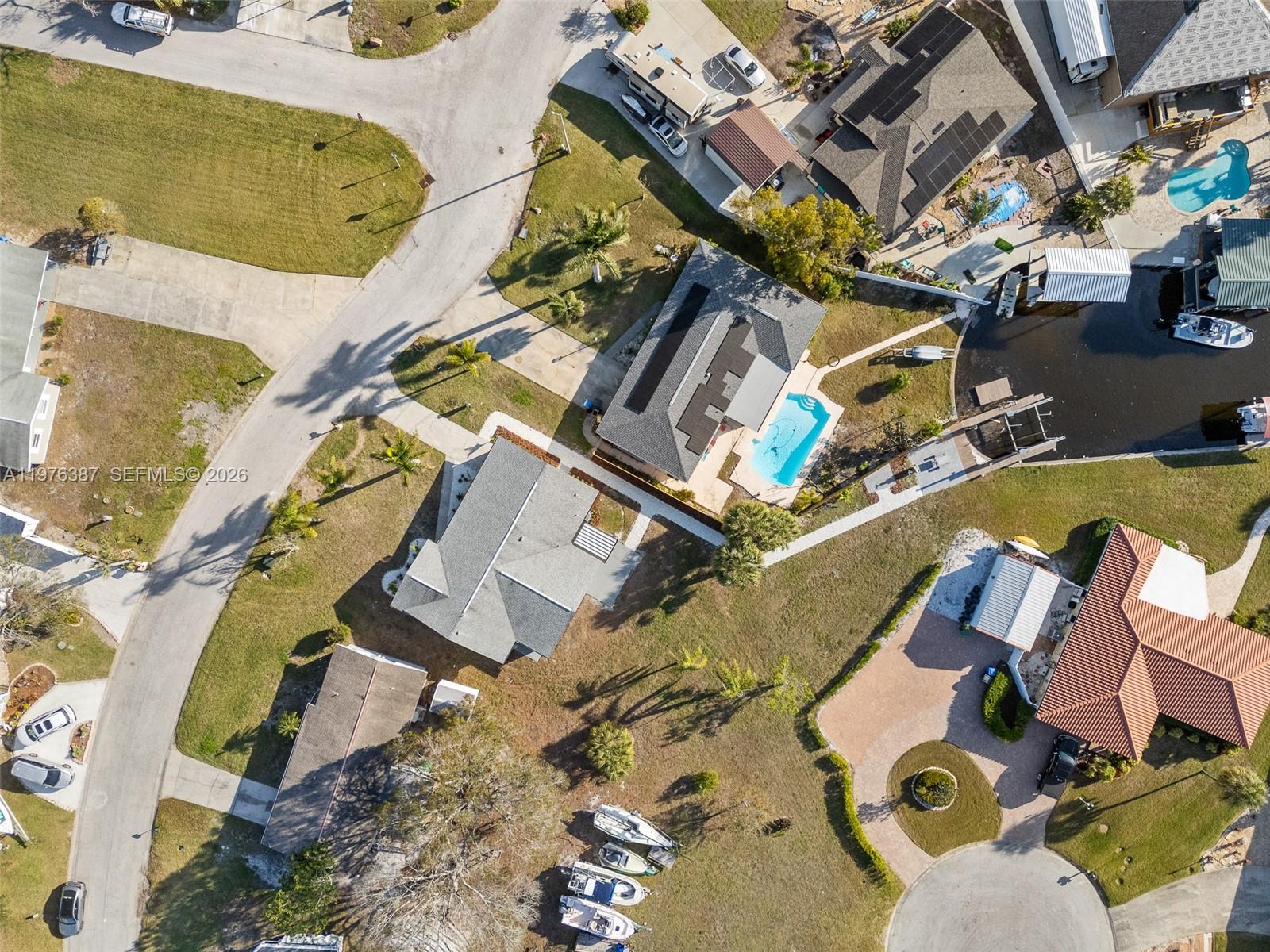 105 12th Street Southwest Ruskin, FL 33570 - Photo 81 of 89 an aerial view of a house with a swimming pool