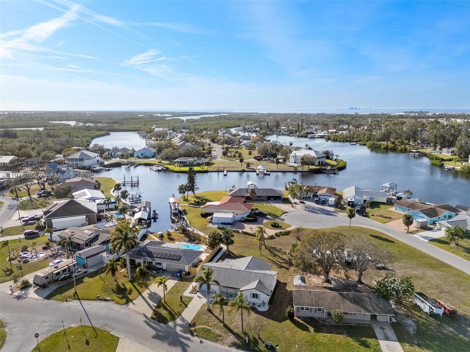 105 12th Street Southwest Ruskin, FL 33570 - Photo 82 of 89 an aerial view of a city with lots of residential buildings ocean and mountain view in back