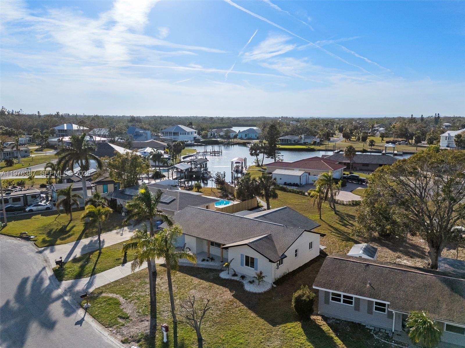 105 12th Street Southwest Ruskin, FL 33570 - Photo 86 of 89 an aerial view of a swimming pool with outdoor seating and city view
