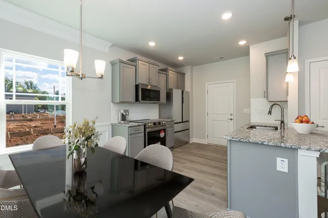 a kitchen with counter space cabinets and appliances