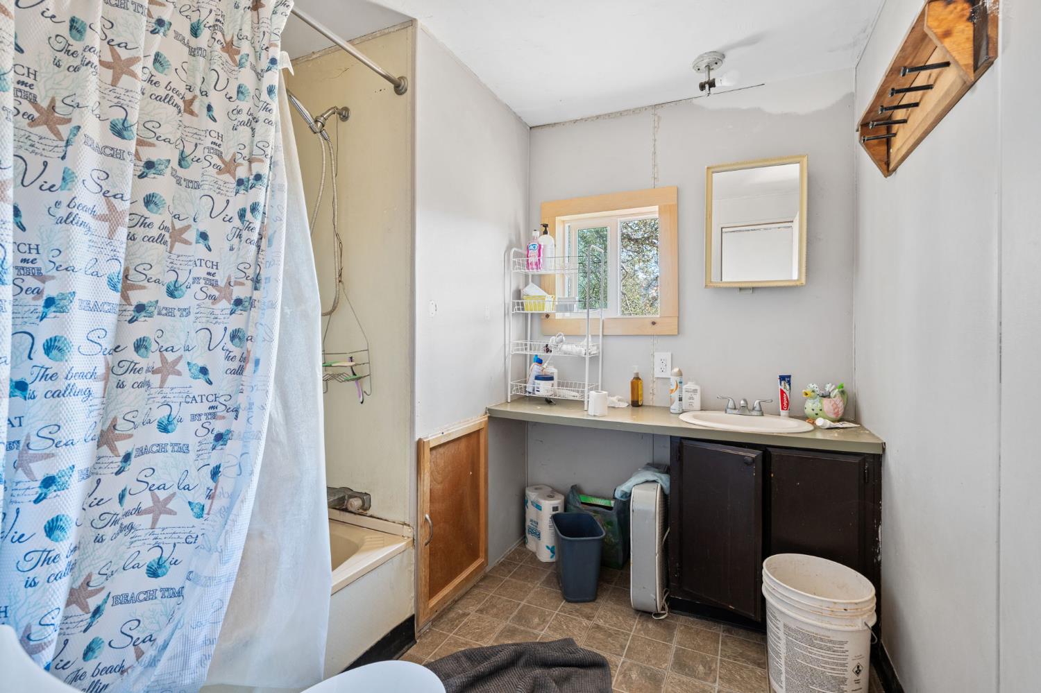 4963 Valley Lane Catheys Valley, CA 95306 - Photo 12 of 40 a bathroom with a sink toilet and shower