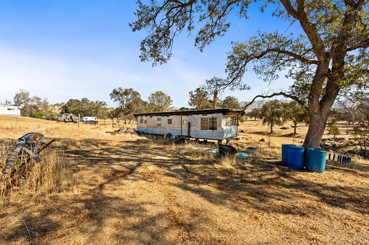 4963 Valley Lane Catheys Valley, CA 95306 - Photo 19 of 40 a view of a house with a yard