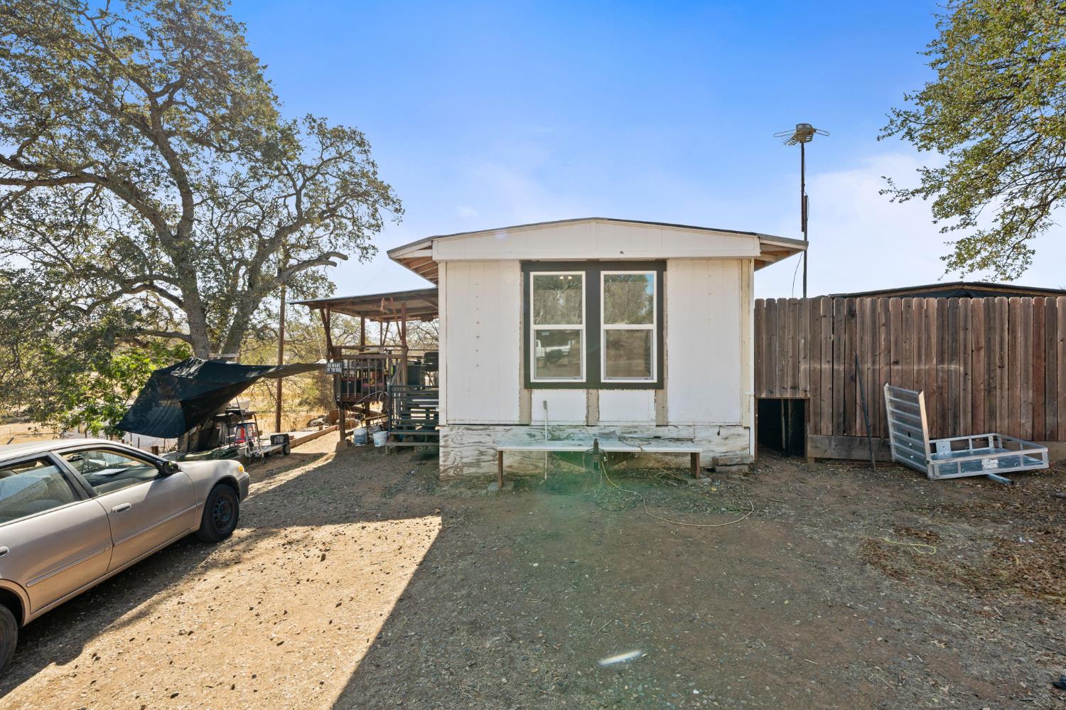 4963 Valley Lane Catheys Valley, CA 95306 - Photo 2 of 40 a view of a car park in front of house