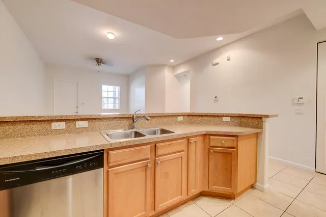 a kitchen with a sink and cabinets