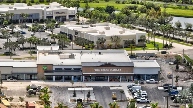 a backyard of a house with a yard and outdoor seating