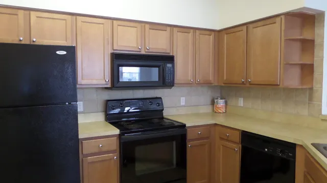 a kitchen with a sink and cabinets