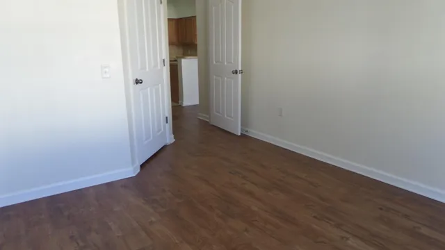 an empty room with wooden floor