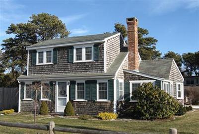 72 Beaten Road Dennis Port, MA 02639 - Photo 1 of 8 a front view of a house with garden