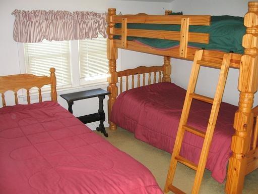 72 Beaten Road Dennis Port, MA 02639 - Photo 6 of 8 a bedroom with a bed and a window