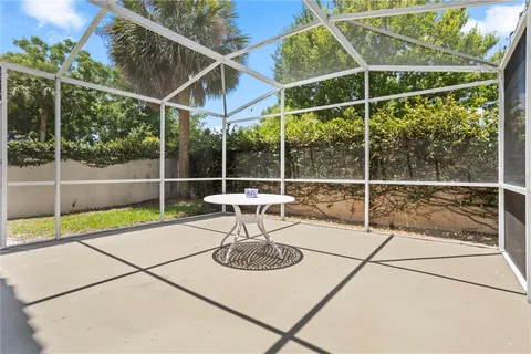 a view of an chair and table in the patio