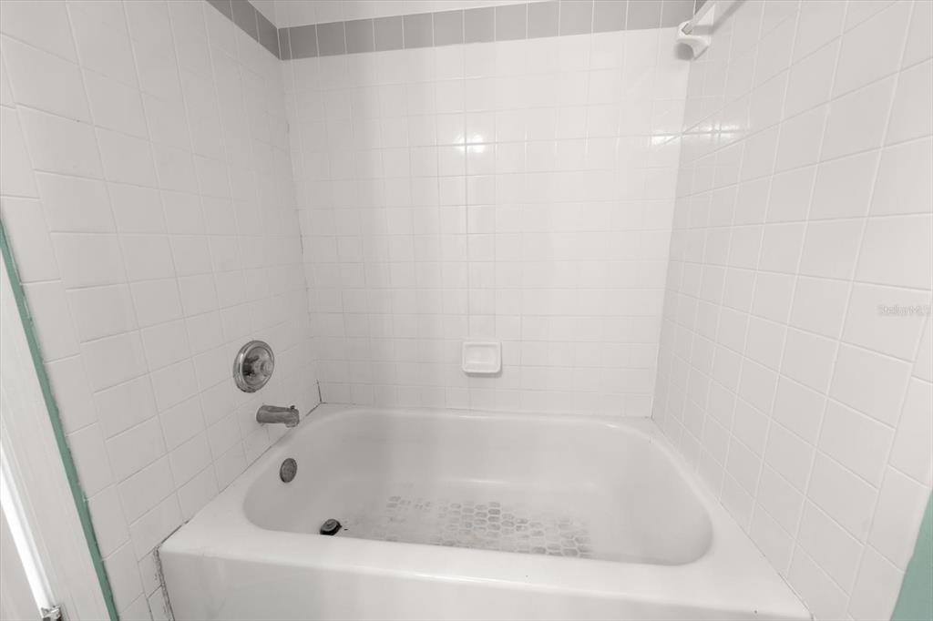 124 Marcdale Boulevard Indian Rocks Beach, FL 33785 - Photo 20 of 55 a bathroom with a bathtub
